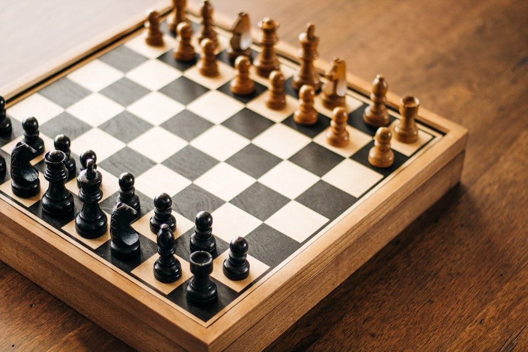 Wooden chessboard with black and brown pieces set for play
